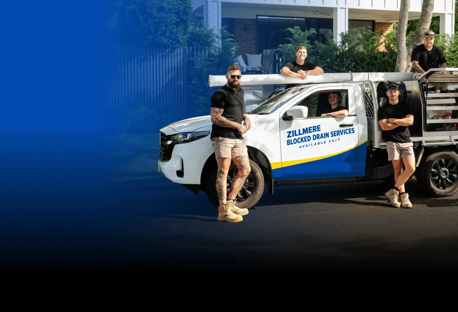 Zillmere Blocked Drain Services team with the ute